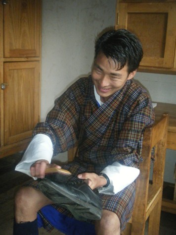 photo: student polishing his shoe